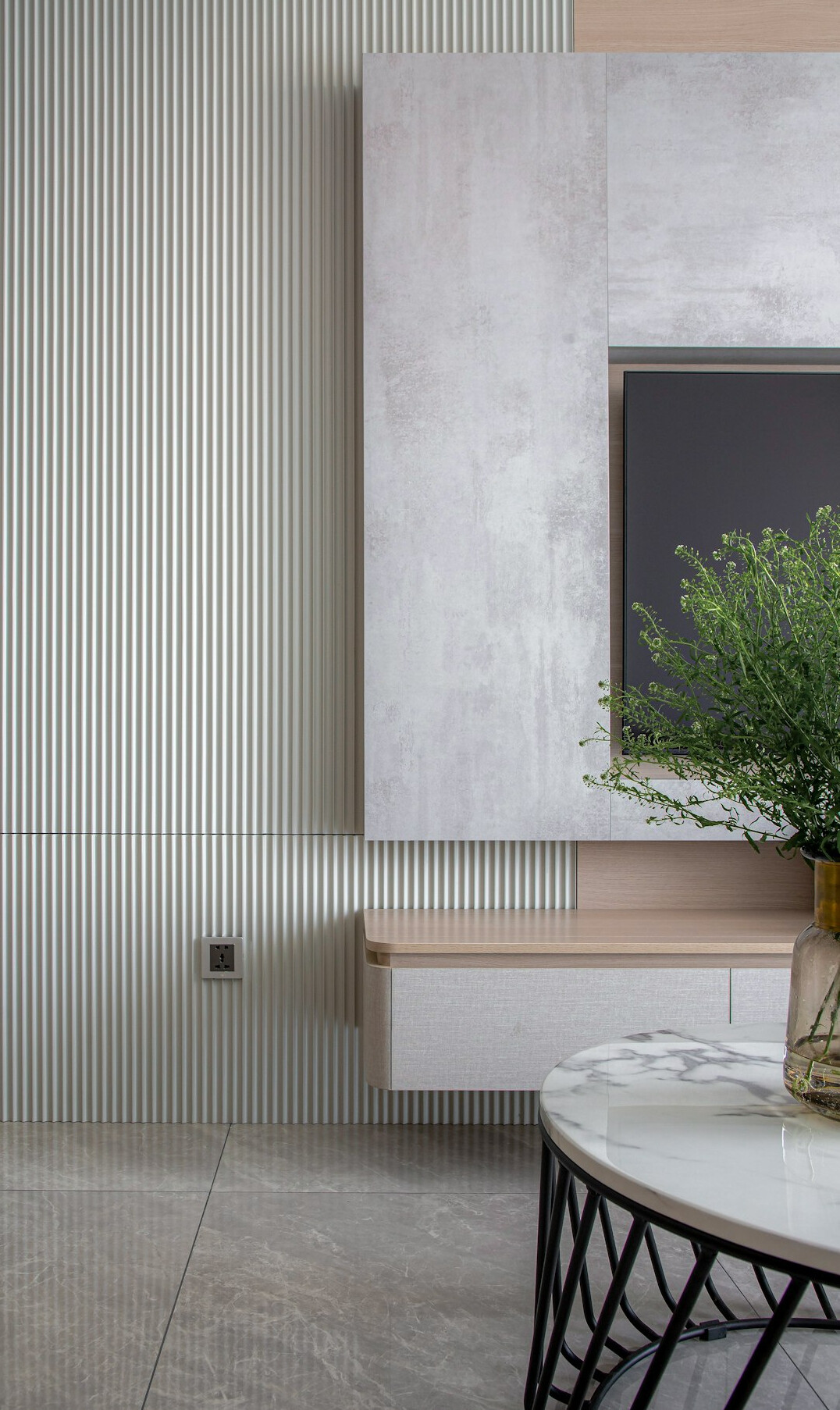 Television set on a wall in a modern living room