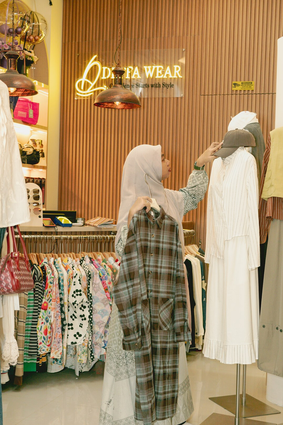 Fashion clothes on a rack in a boutique
